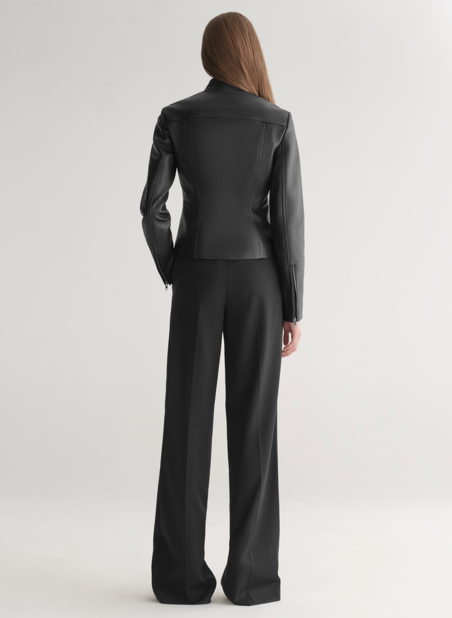 woman wearing black leather jacket and black pants