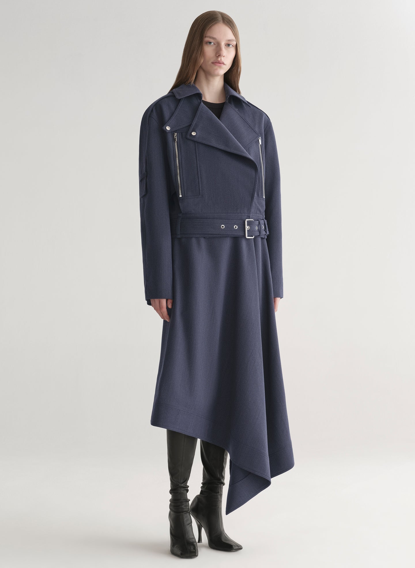 woman wearing navy blue jacket and matching skirt