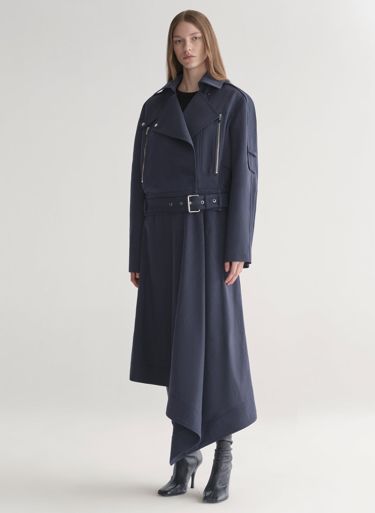 woman wearing navy blue jacket and matching skirt