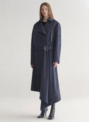 woman wearing navy blue jacket and matching skirt