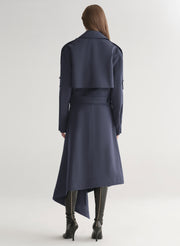 woman wearing navy blue jacket and matching skirt