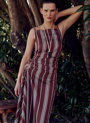 woman wearing brown striped linen dress