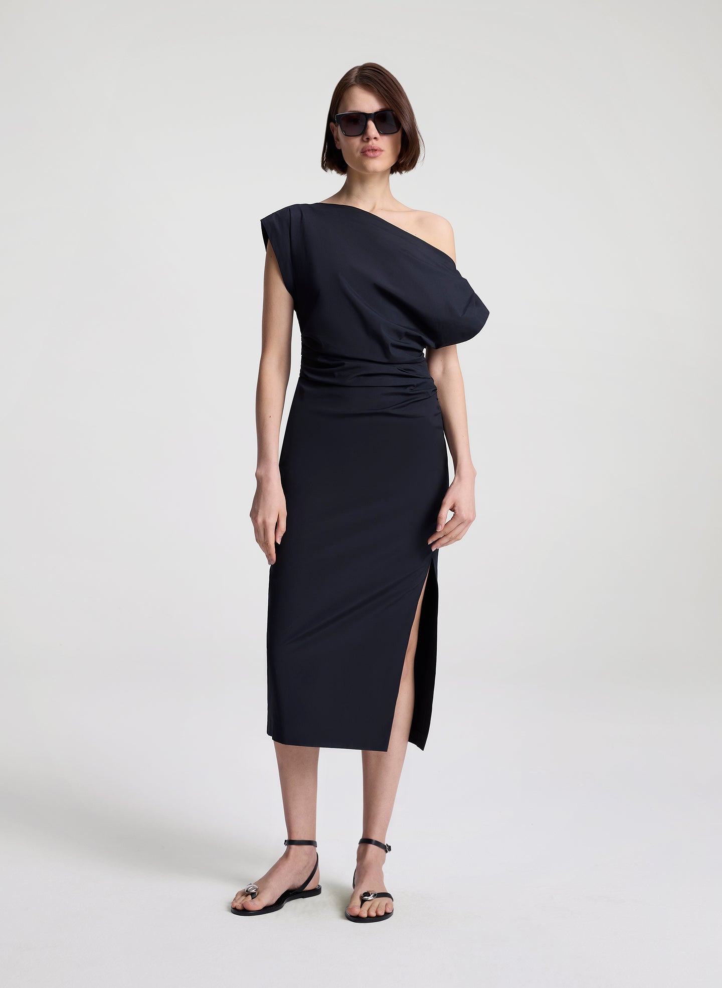 woman wearing black off shoulder midi dress