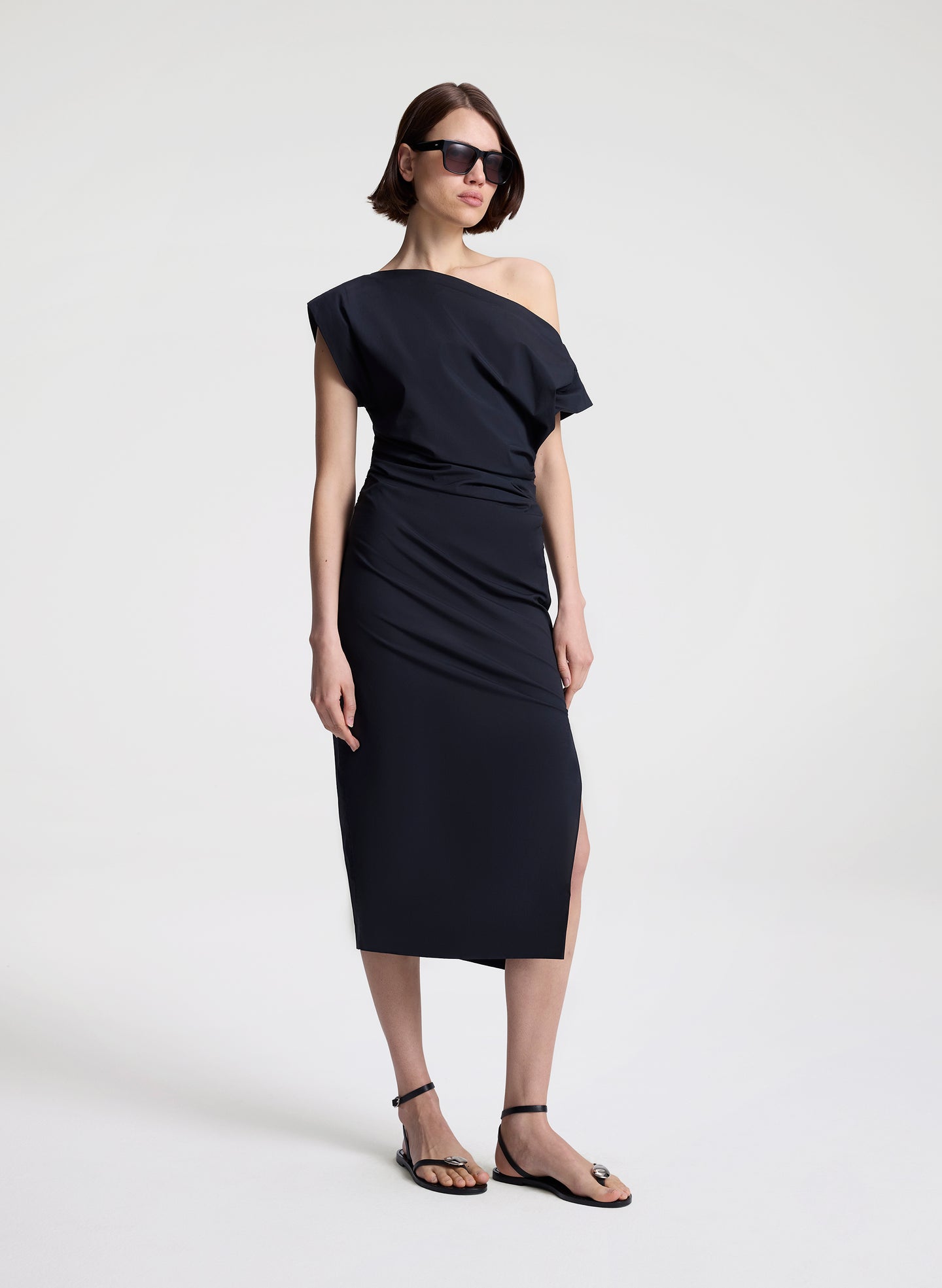 woman wearing black off shoulder midi dress
