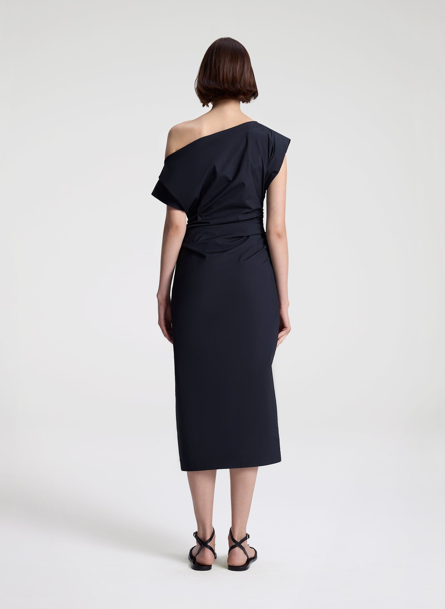 woman wearing black off shoulder midi dress