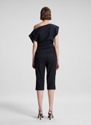 woman wearing black off the shoulder top and black capri pants