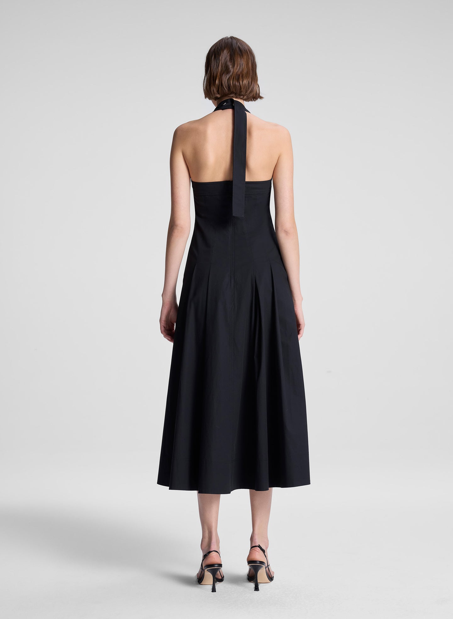 woman wearing black midi dress