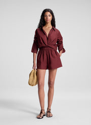 woman wearing burgundy cropped shirt and matching shorts