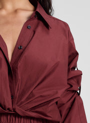 woman wearing burgundy twist front shirt and matching shorts