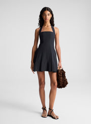 woman wearing black minidress