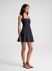 woman wearing black minidress