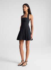 woman wearing black minidress