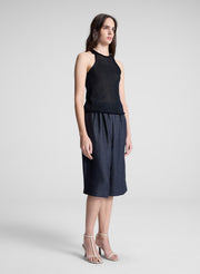 woman wearing navy blue knit tank and navy blue shorts