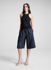 woman wearing navy blue knit tank and navy blue shorts