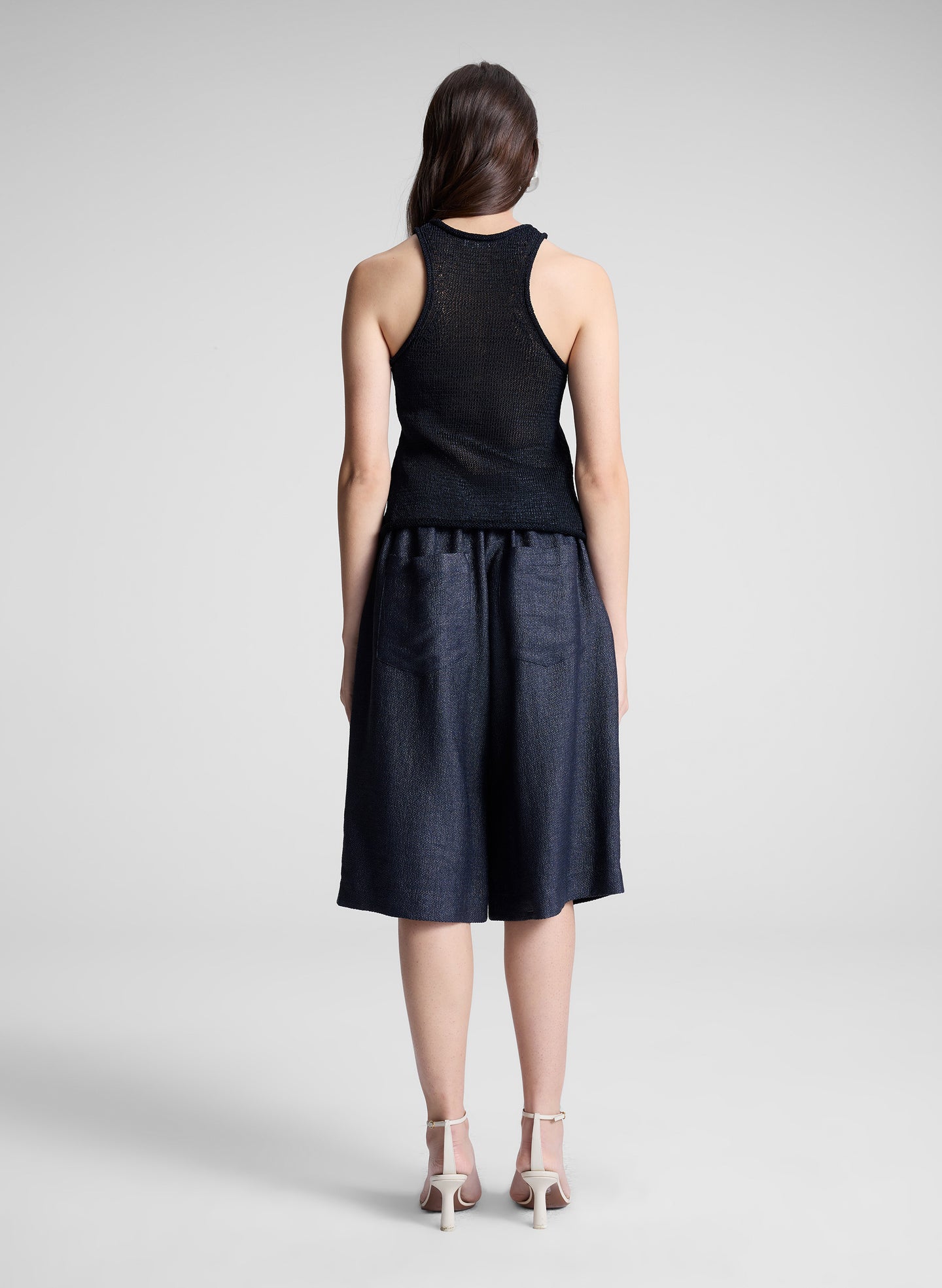 woman wearing navy blue knit tank and navy blue shorts