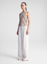 woman wearing beige tank top and beige pants