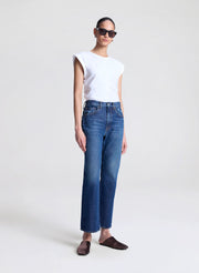 woman wearing white tshirt and medium blue wash denim jeans