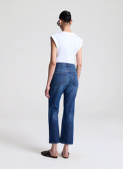 woman wearing white tshirt and medium blue wash denim jeans