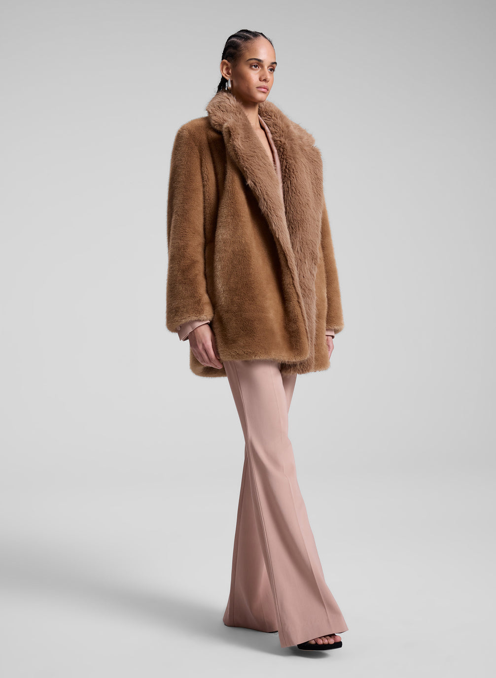 woman wearing brown faux fur coat