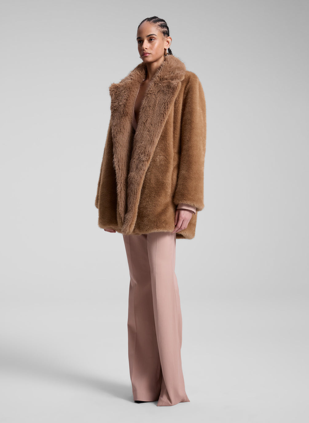 woman wearing brown faux fur coat