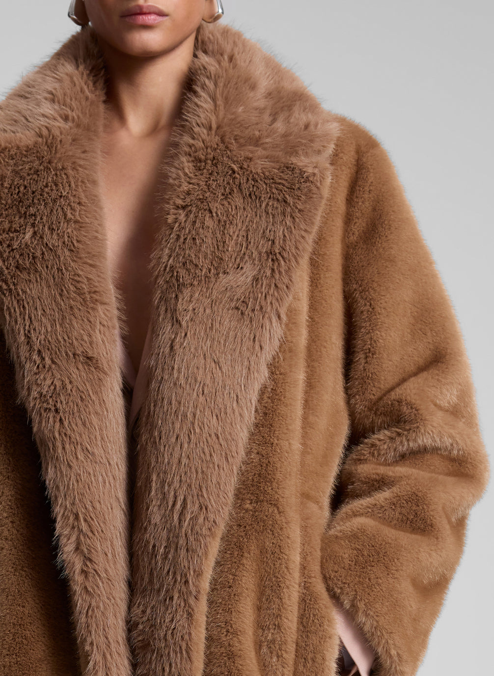 woman wearing brown faux fur coat