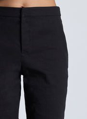 woman wearing black vest top and black capri pants