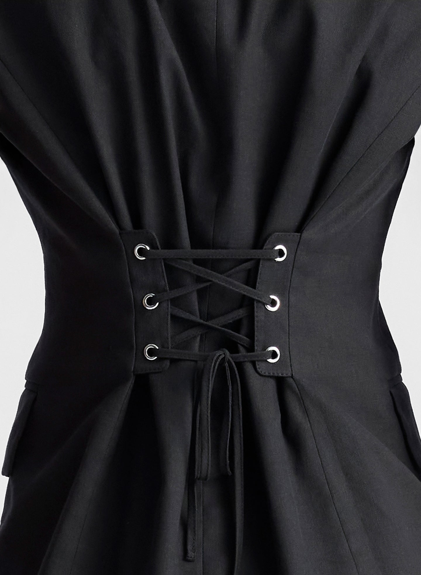 woman wearing black vest and black capri pants