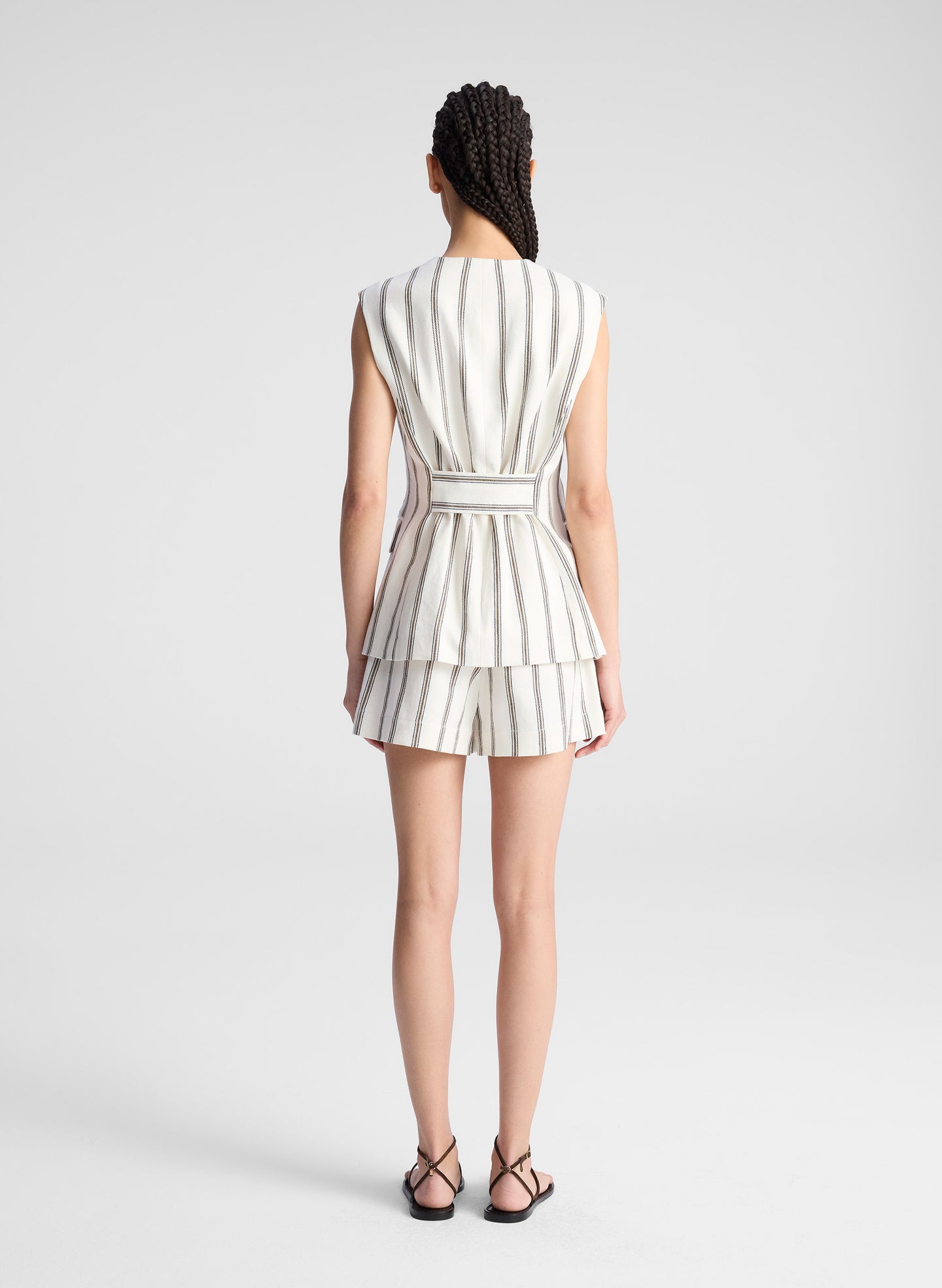 woman wearing striped vest and matching shorts