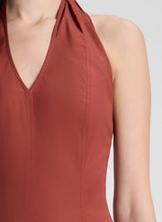 woman wearing maroon drop waist midi dress