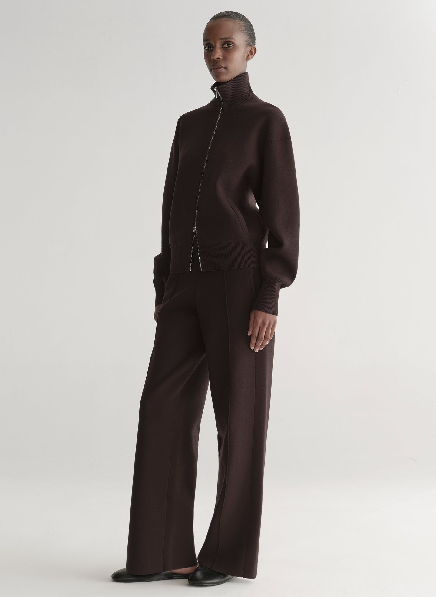 woman wearing brown zip cardigan and matching pants