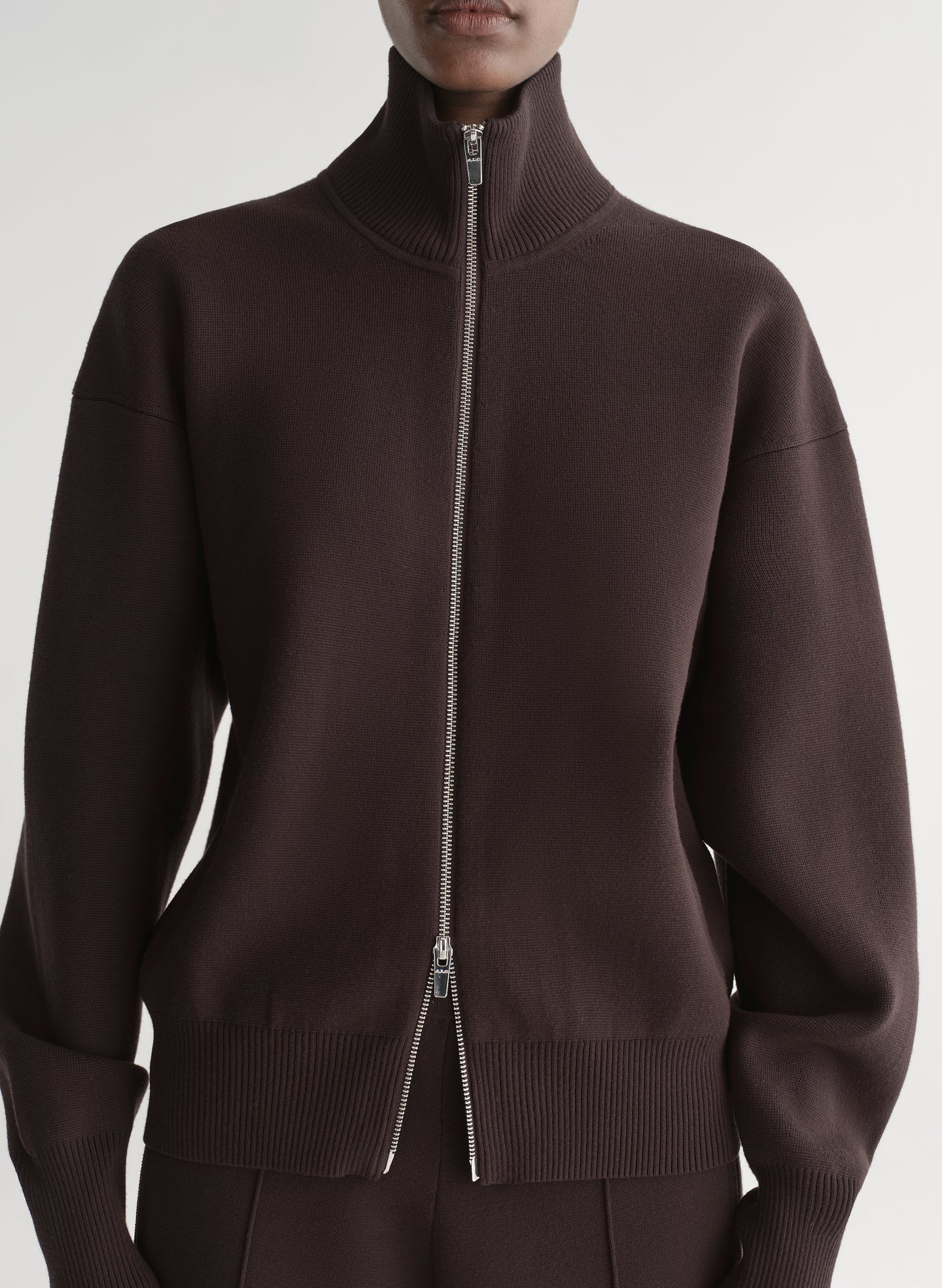 woman wearing brown zip cardigan and matching pants