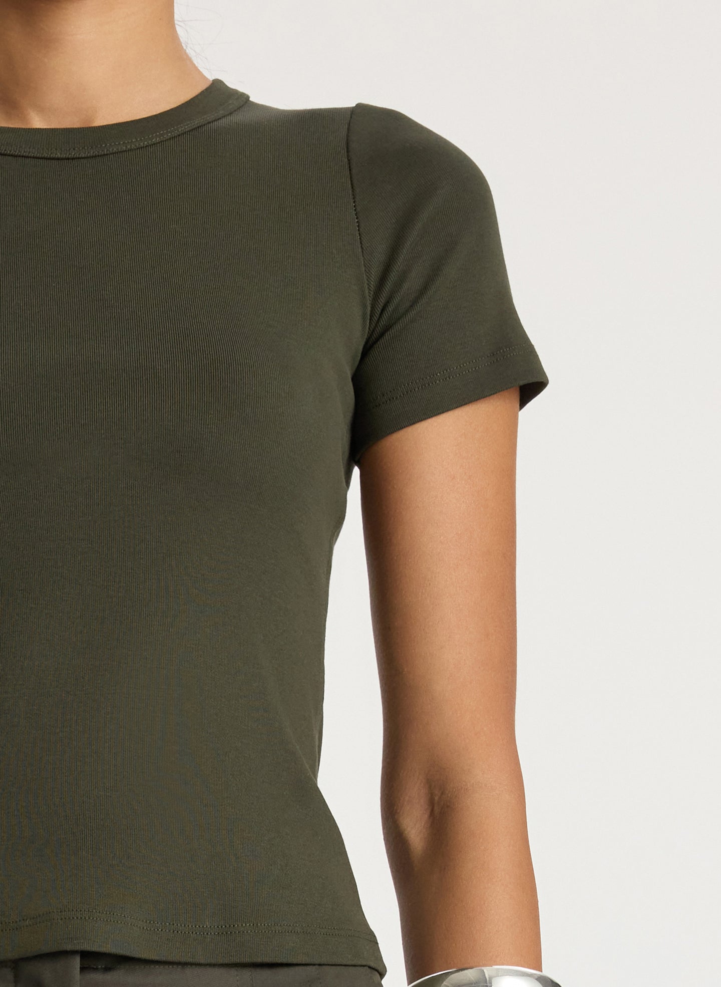detail  view of woman wearing olive green tshirt and olive green wide leg pants