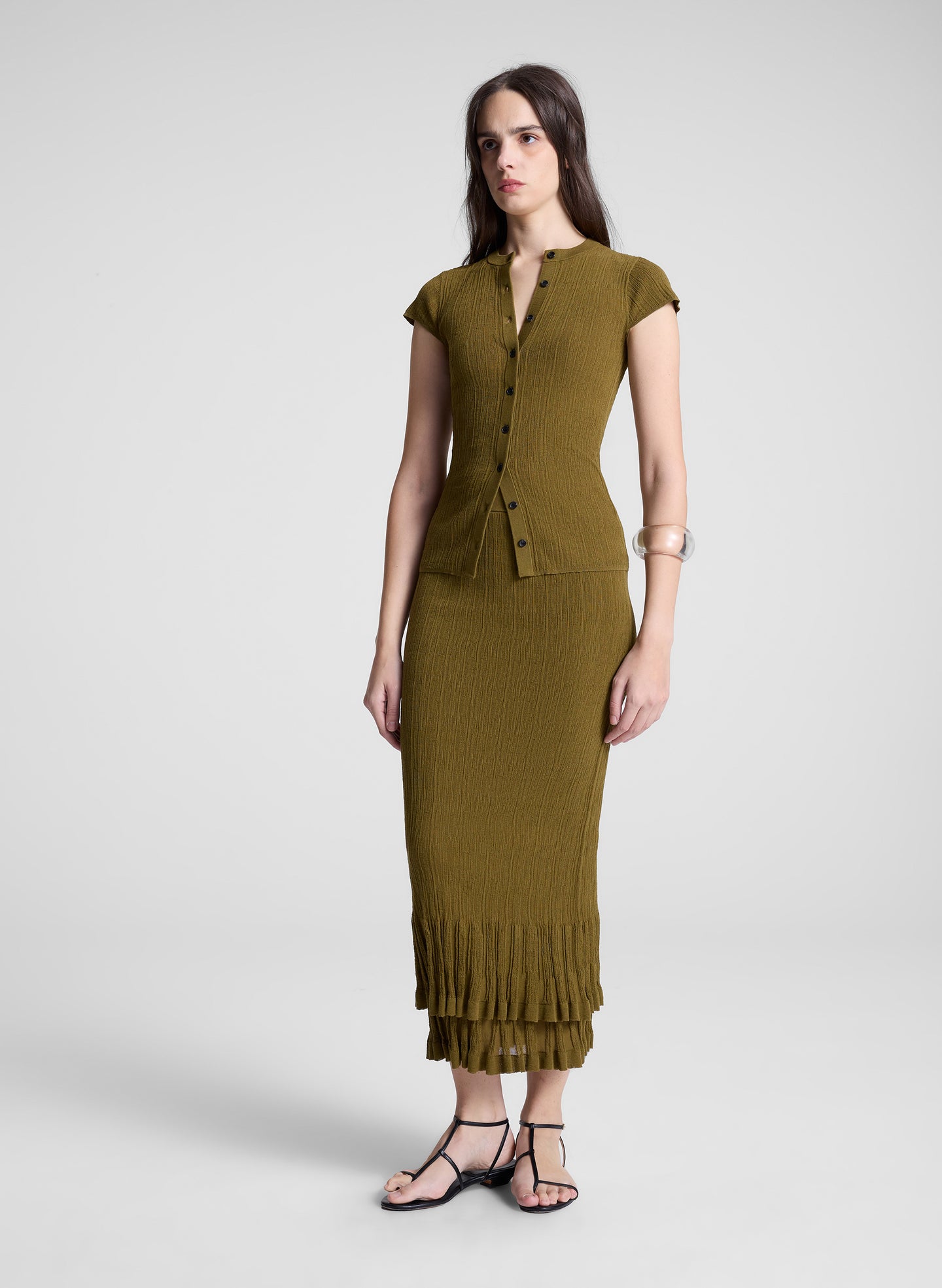 woman wearing brown short sleeve knit top and matching knit midi skirt