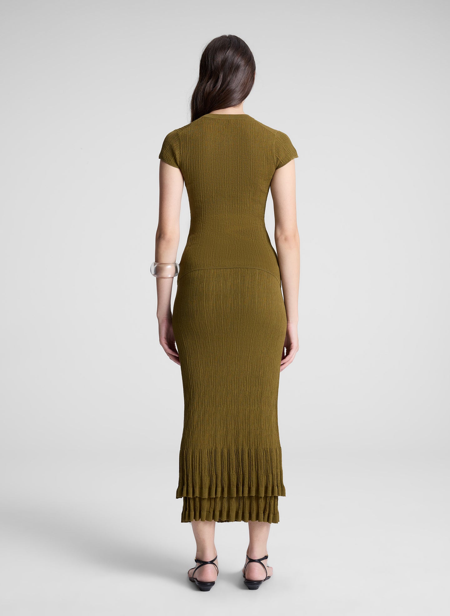 woman wearing brown short sleeve knit top and matching knit midi skirt