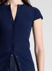 woman wearing navy cardigan and navy pants
