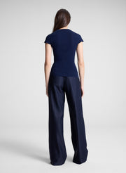 woman wearing navy cardigan and navy pants