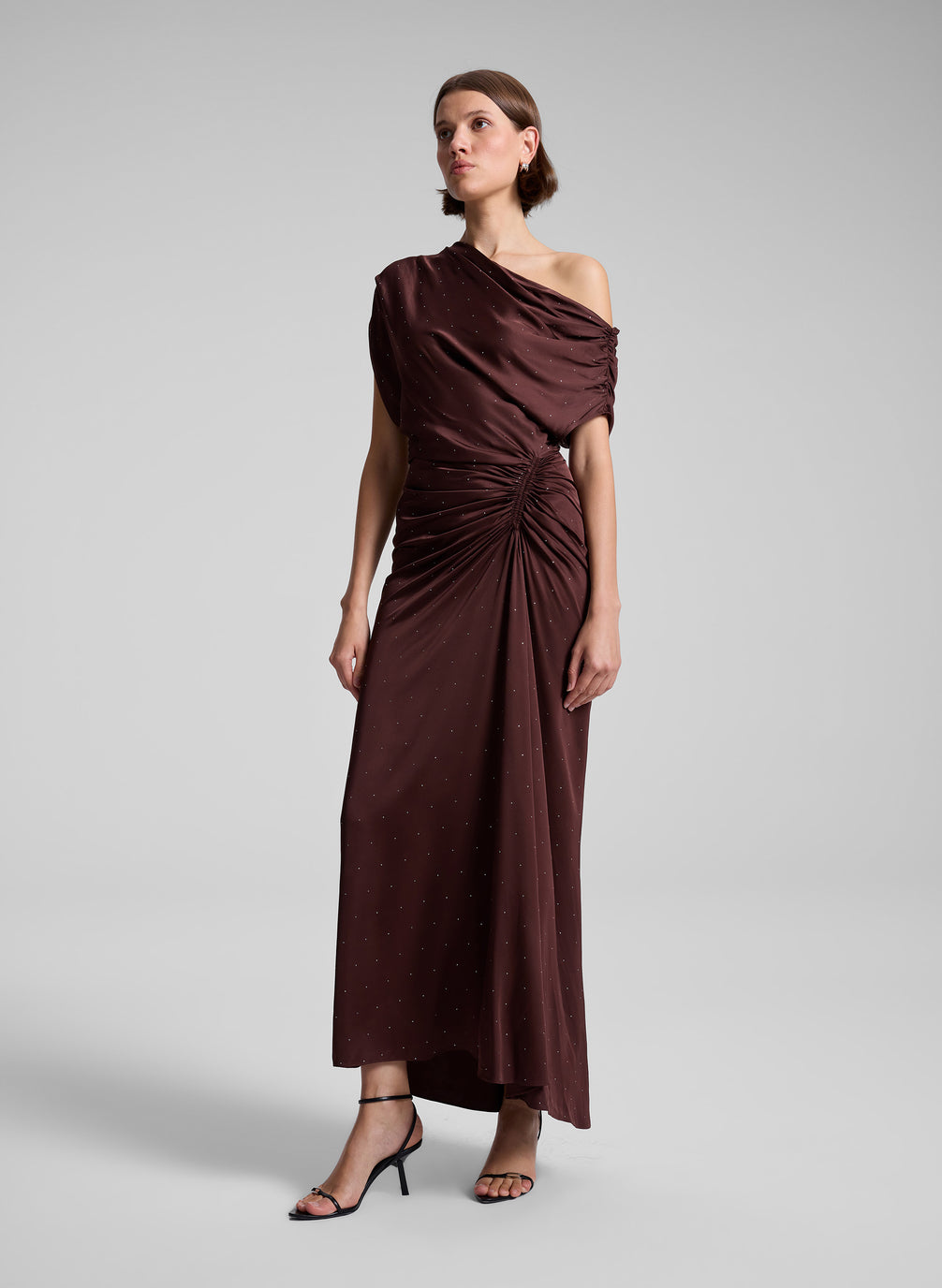 woman wearing brown satin embellished dress