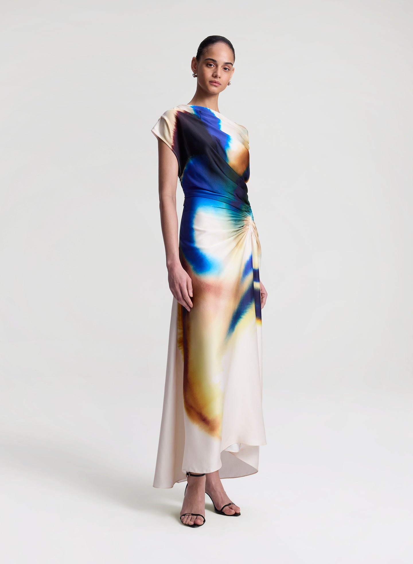 woman wearing multicolor satin maxi dress