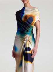 woman wearing multicolor satin maxi dress