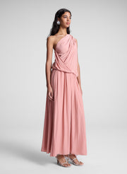 woman wearing pink one shoulder top and matching maxi skirt