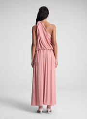 woman wearing pink one shoulder top and matching maxi skirt