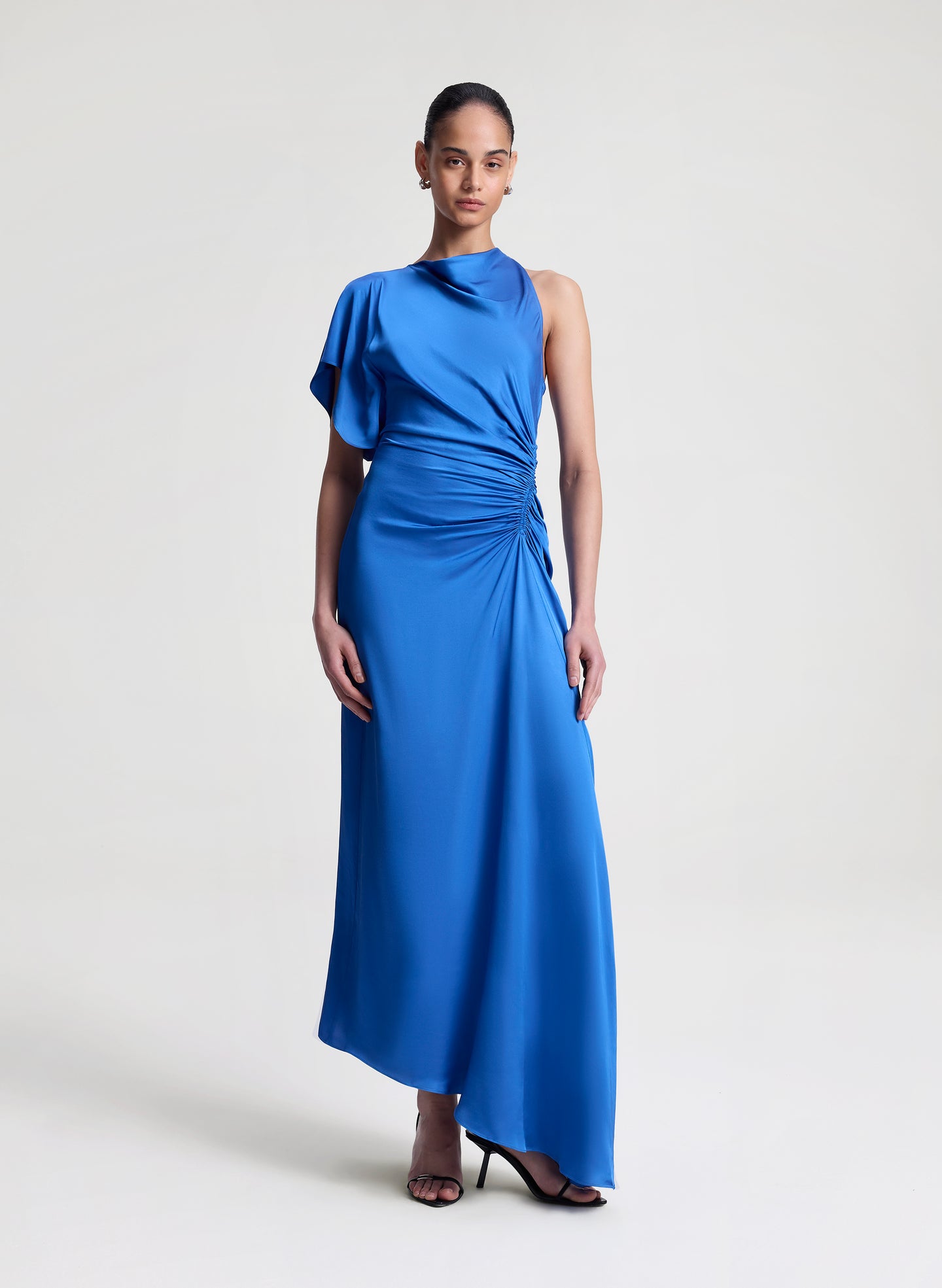 woman wearing blue satin maxi dress