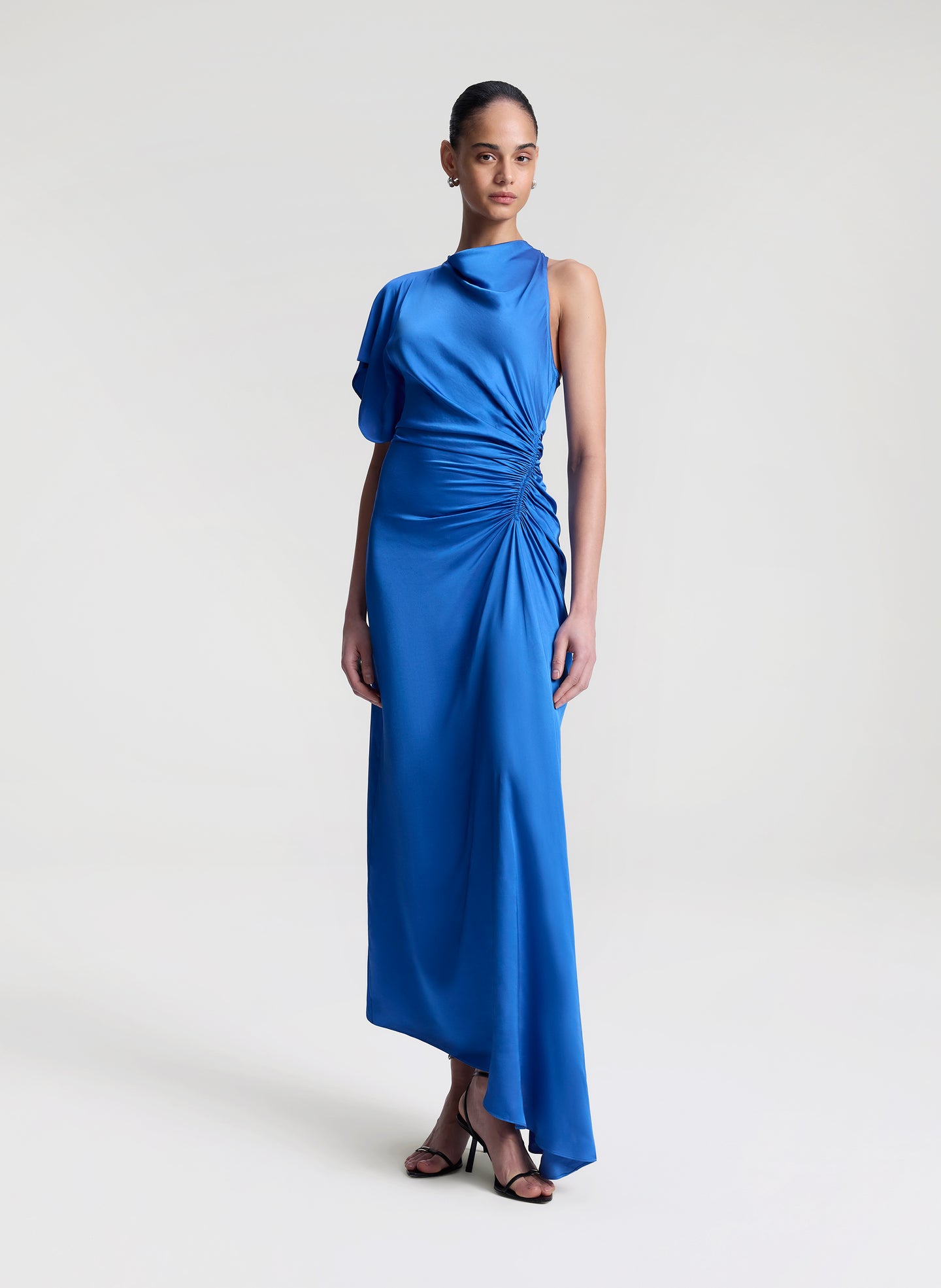 woman wearing blue satin maxi dress