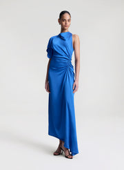 woman wearing blue satin maxi dress