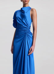 woman wearing blue satin maxi dress