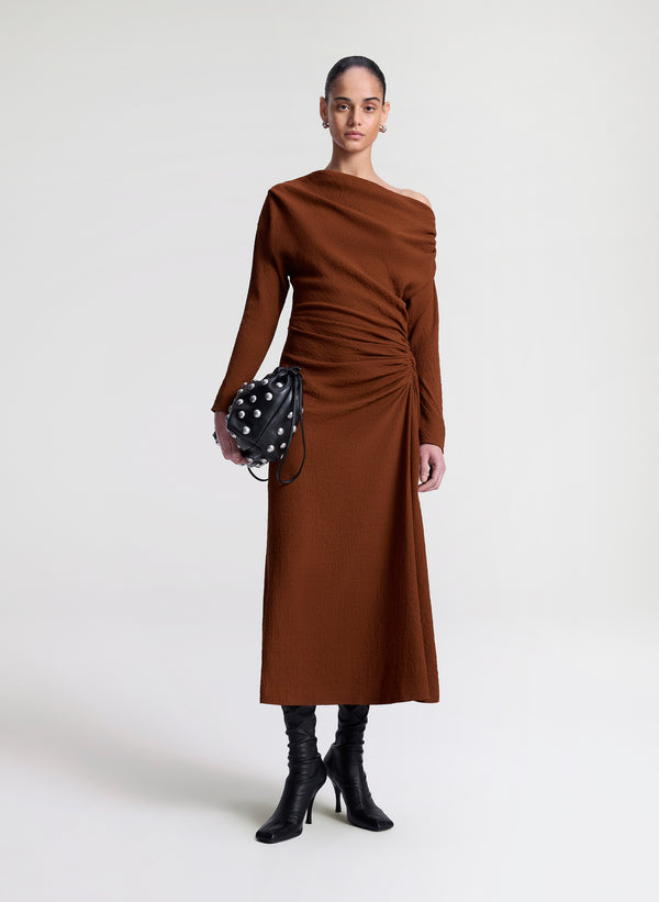 woman wearing brown dress