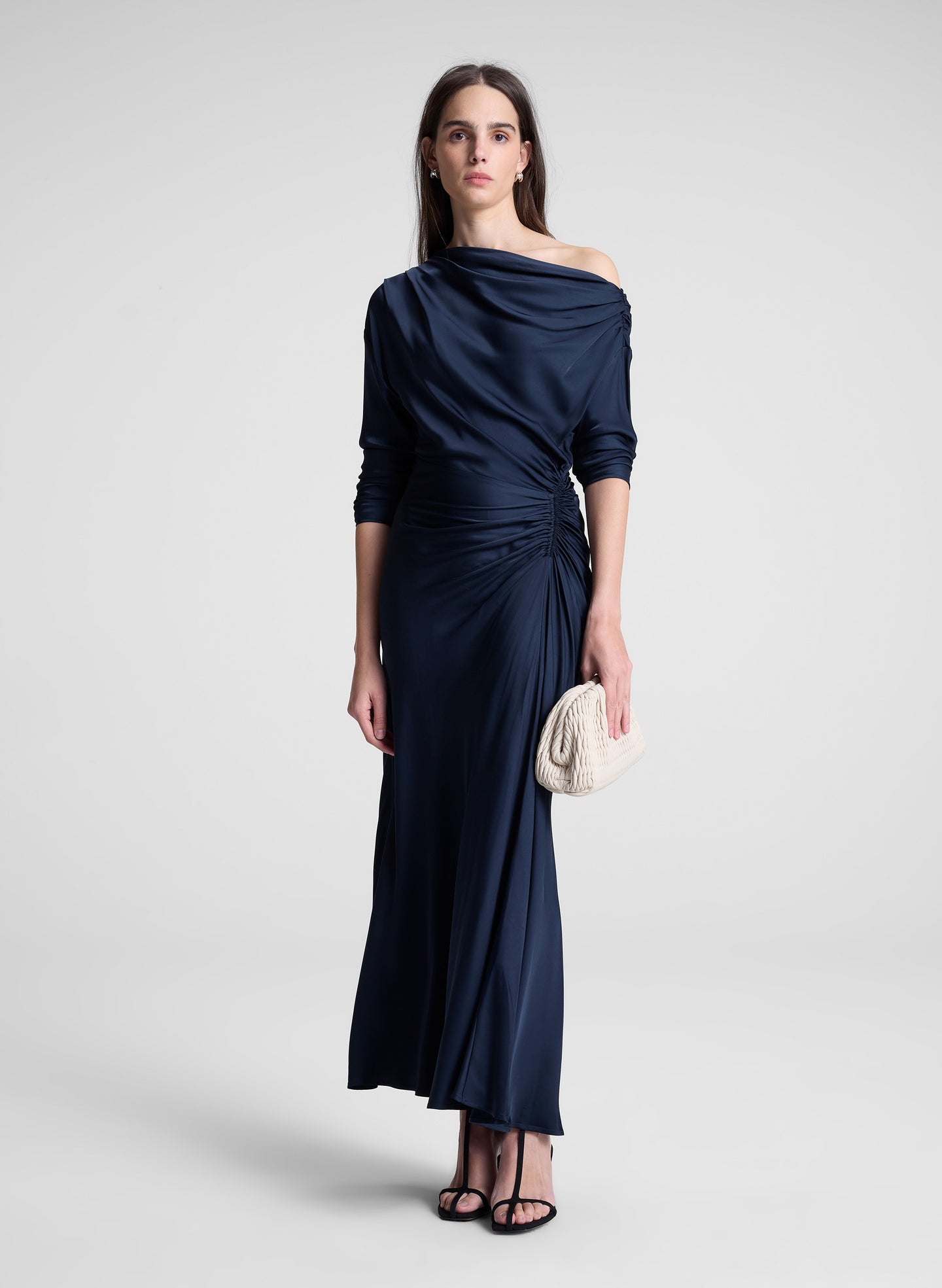 woman wearing navy blue satin maxi dress