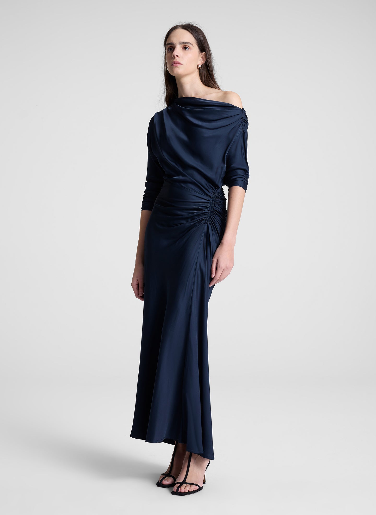 woman wearing navy blue satin maxi dress