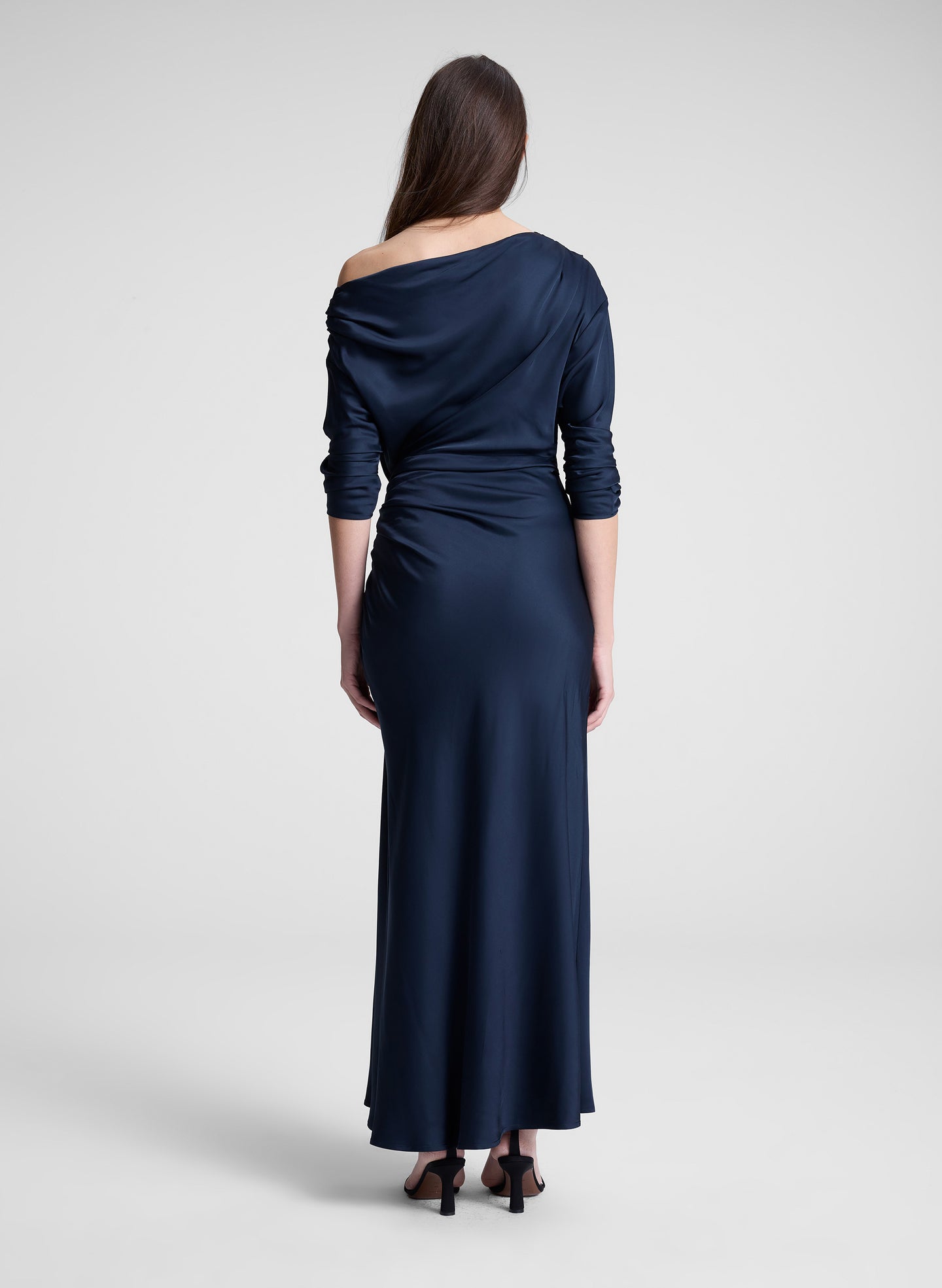 woman wearing navy blue satin maxi dress