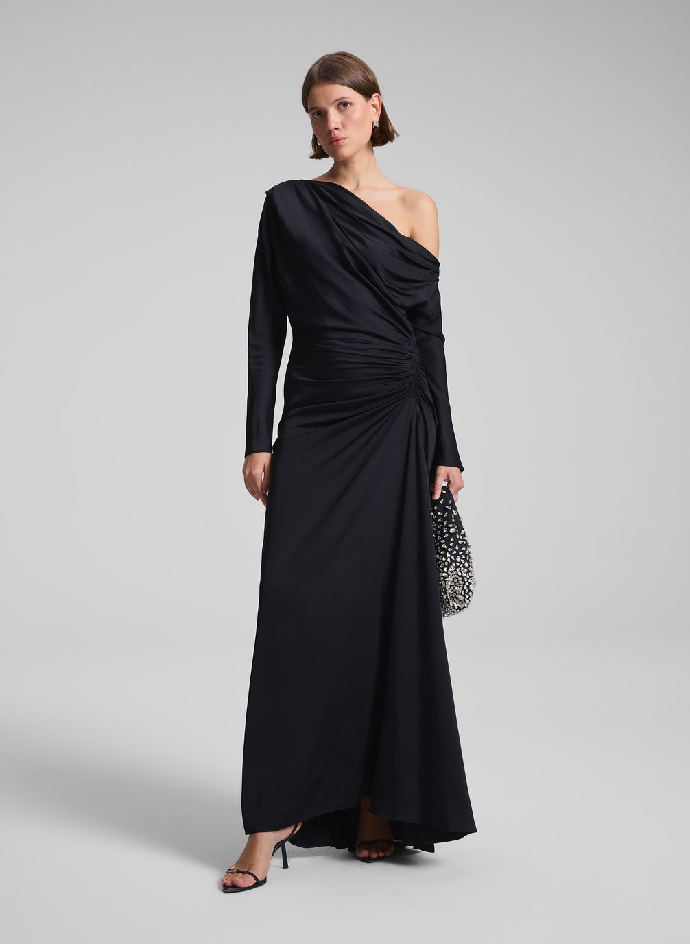 woman wearing black satin gown